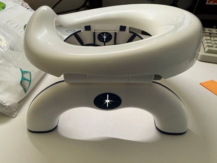 Oxo travel potty potty training foldable with 100 disposable bags