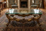 Very nice glass topped coffee table.