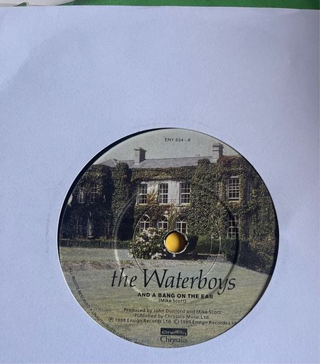 The waterboys. And a bang on the ear vinyl record