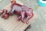 carved wooden elephant and 2 Buddha