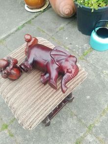 carved wooden elephant and 2 Buddha