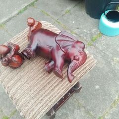 carved wooden elephant and 2 Buddha