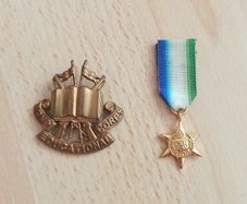 Brass British army cap badge for the Army Educational Corps (AEC) circa 1920 - 1946 & Atlantic Star, a British World War II campaign medal  copy