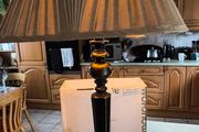 Vintage ebonized table lamp featuring an octagonal base, likely dating from the early 20th century.