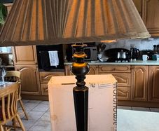 Vintage ebonized table lamp featuring an octagonal base, likely dating from the early 20th century.