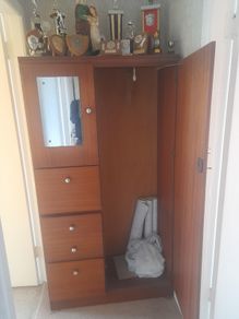 Wooden wardrobe with drawers and mirror