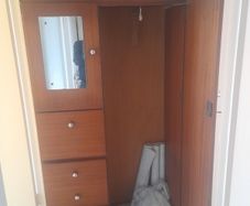 Wooden wardrobe with drawers and mirror