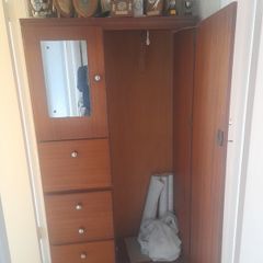 Wooden wardrobe with drawers and mirror