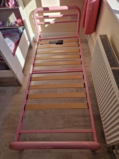 Pink metal frame toddler bed