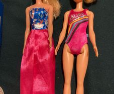 Two Barbie Dolls.