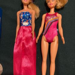 Two Barbie Dolls.