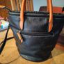 David Jones  is a classic, two-tone black pebbled Faux leather bucket bag. Image 4