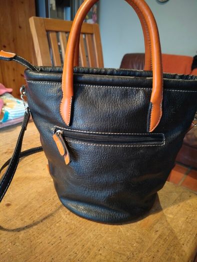 David Jones  is a classic, two-tone black pebbled Faux leather bucket bag.