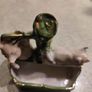 figurine of two pigs cooling down at bone china  water pump. Image 6