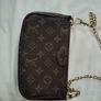 Lovely clutch L V logo Image 4