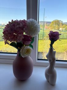 Stylish decorative vases with faux flowers