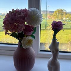 Stylish decorative vases with faux flowers