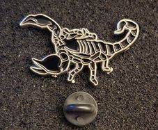 Scorpion , pin back badge.