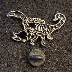 Scorpion , pin back badge.