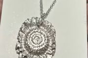 Handmade solid fine silver flower pendant on an 18 inch necklace