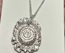 Handmade solid fine silver flower pendant on an 18 inch necklace