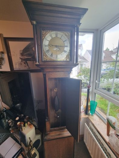A Georgian grandfather clock made by the English clockmaker John Rogers of Leominster
