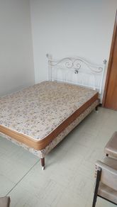 metal double bed and mattress