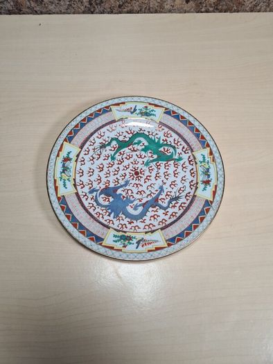 Vintage chinese porcelain plate with dragons decoration hand painted