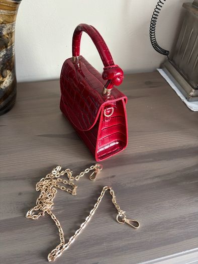 Red handbag with chain