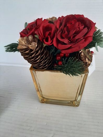 New artificial flower arrangement in vase tag attached