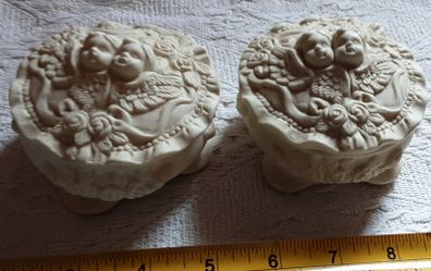 two vintage cherub pots with lids