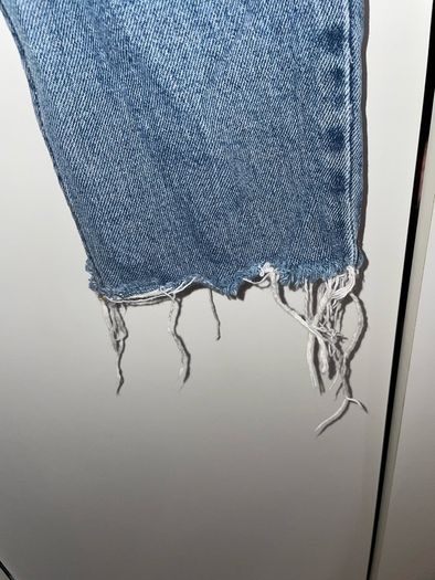 Distressed blue jeans