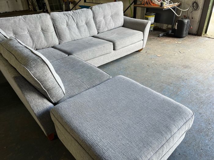 Grey corner sofa with matching footstool
