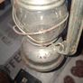 Beautiful Old Hurricane Lantern, Post Available, The lantern features a central glass globe protected by a metal cage, designed to shield the flame from wind while providing light Image 4