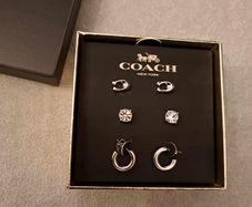 Coach stud earings