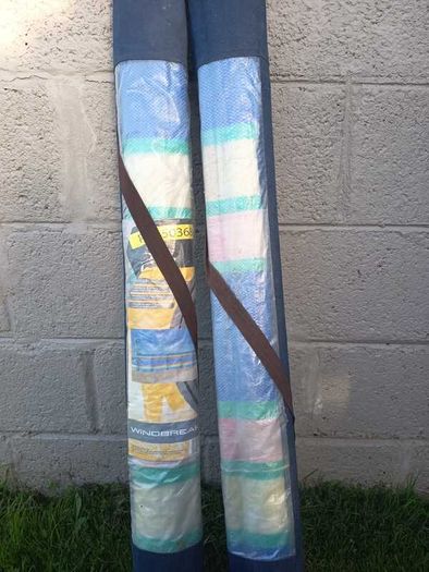 Pair of windbreaks with blue carry covers