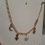 Golden necklace with charms Image 4
