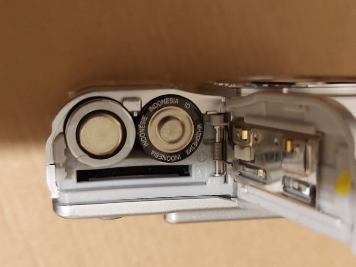 Z880 Digital Camera, Takes 2AA Batteries, working fine, has a modification that doesn't affect its performance