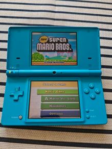 Nintendo DSi handheld console With Super Mario Bros