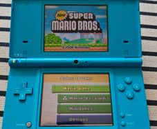 Nintendo DSi handheld console With Super Mario Bros