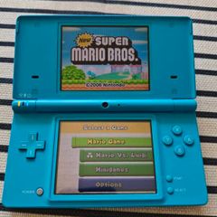 Nintendo DSi handheld console With Super Mario Bros