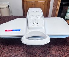 Electronic steam ironing press