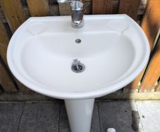 Bathroom sink, tap and pedestal