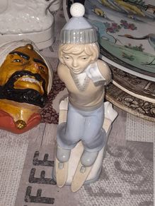 Old Ornament of a Boy in a Winter Hat and Light Colored Clothing on Skis, Made in Spain.