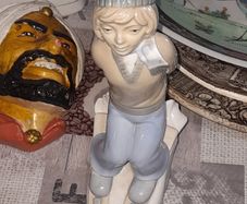 Old Ornament of a Boy in a Winter Hat and Light Colored Clothing on Skis, Made in Spain.