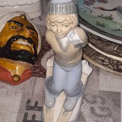 Old Ornament of a Boy in a Winter Hat and Light Colored Clothing on Skis, Made in Spain.