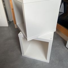 2 white storage units or bedside tables