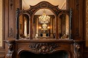 This is a massive old inlaid wooden framed triple arched mirror.