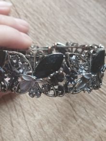 Beautiful flower cuff bracelet with rhinestones butterflies.