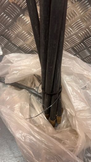 Chimney sweeping set with 7 flexible rods and chimney brush.